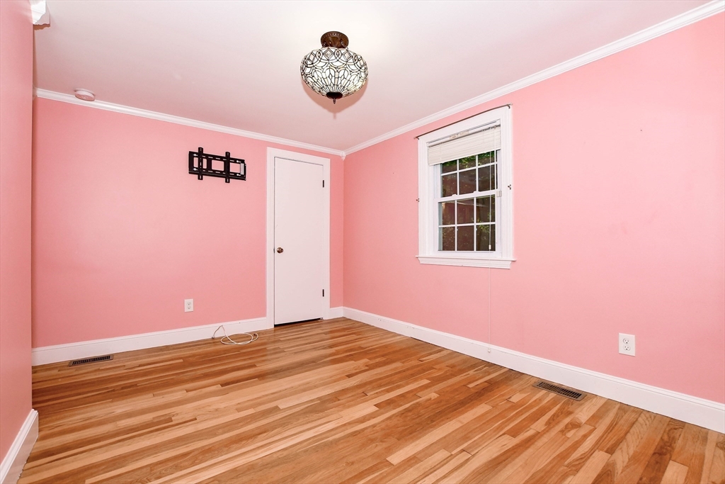 1251 Broadway Hanover, MA 02339 - Photo 21 of 39 a view of an empty room with a window