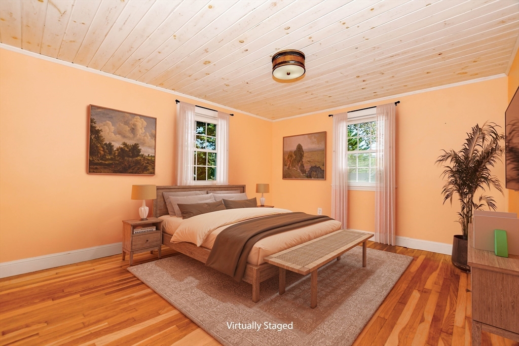 1251 Broadway Hanover, MA 02339 - Photo 23 of 39 a bedroom with a bed and a large window with outer view