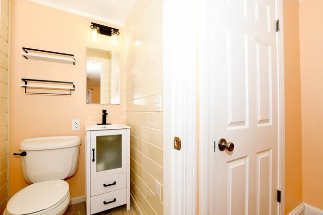 a bathroom with a toilet sink and shower