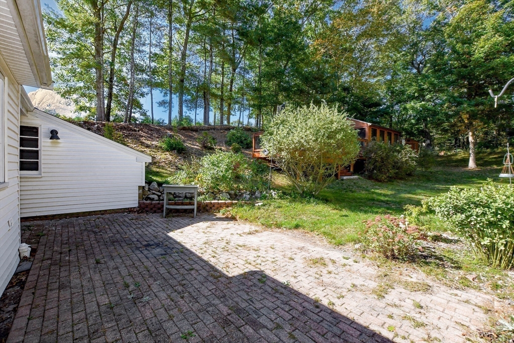 1251 Broadway Hanover, MA 02339 - Photo 29 of 39 a view of a backyard with plants and large trees