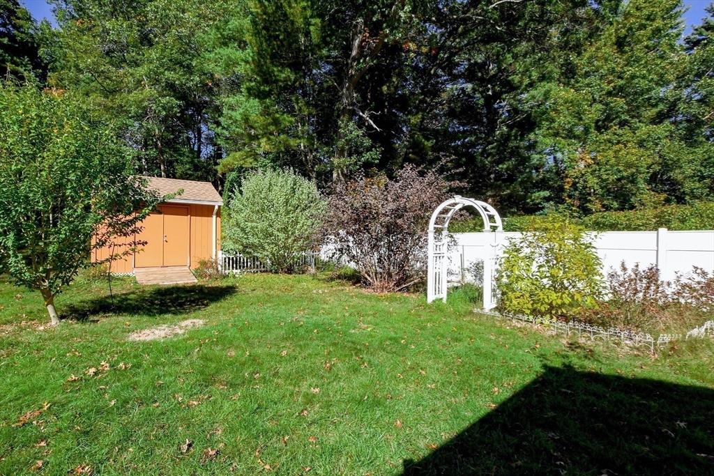 1251 Broadway Hanover, MA 02339 - Photo 30 of 39 a backyard of a house with lots of green space and fountain