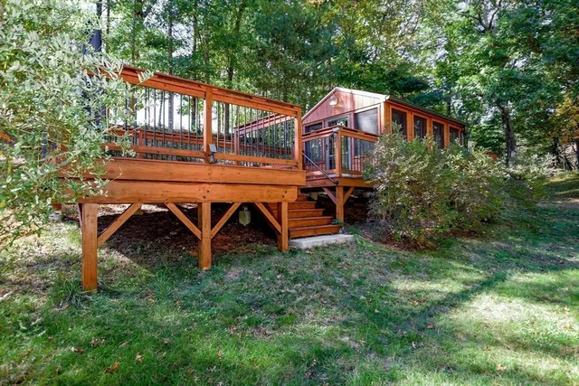 an outdoor view of house with backyard and swimming pool