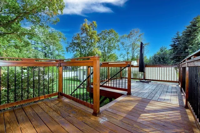 a swimming pool with outdoor seating and yard