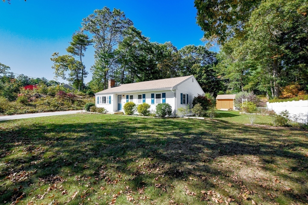 1251 Broadway Hanover, MA 02339 - Photo 37 of 39 a front view of a house with a yard