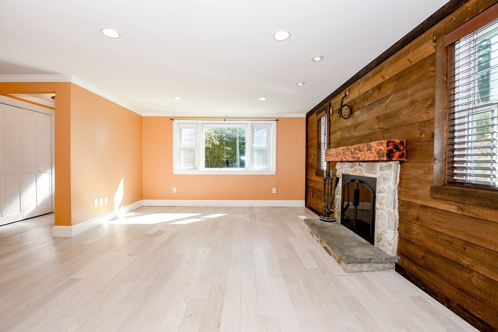 1251 Broadway Hanover, MA 02339 - Photo 6 of 39 a view of a livingroom with a fireplace