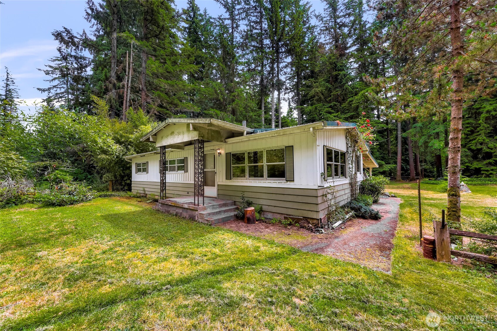 5650 Doran Road Acme, WA 98220 - Photo 16 of 40 a backyard of a house with yard table and chairs