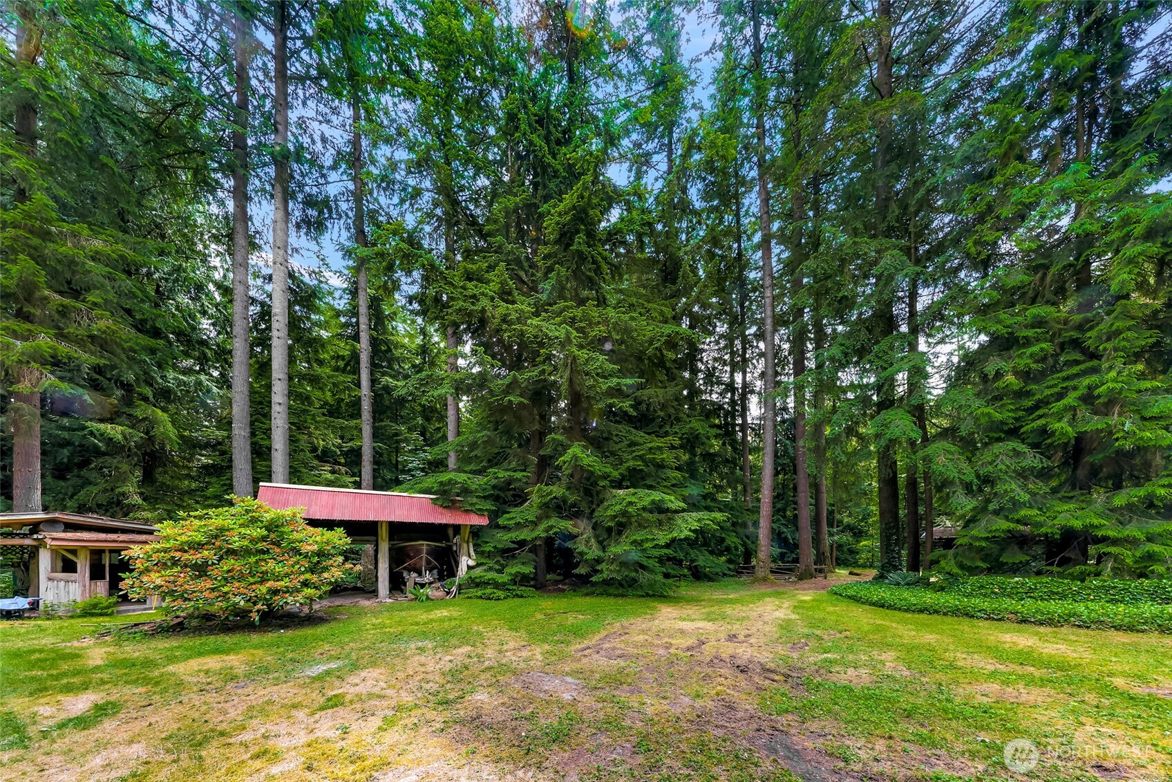 5650 Doran Road Acme, WA 98220 - Photo 27 of 40 a view of a table and chairs under an umbrella