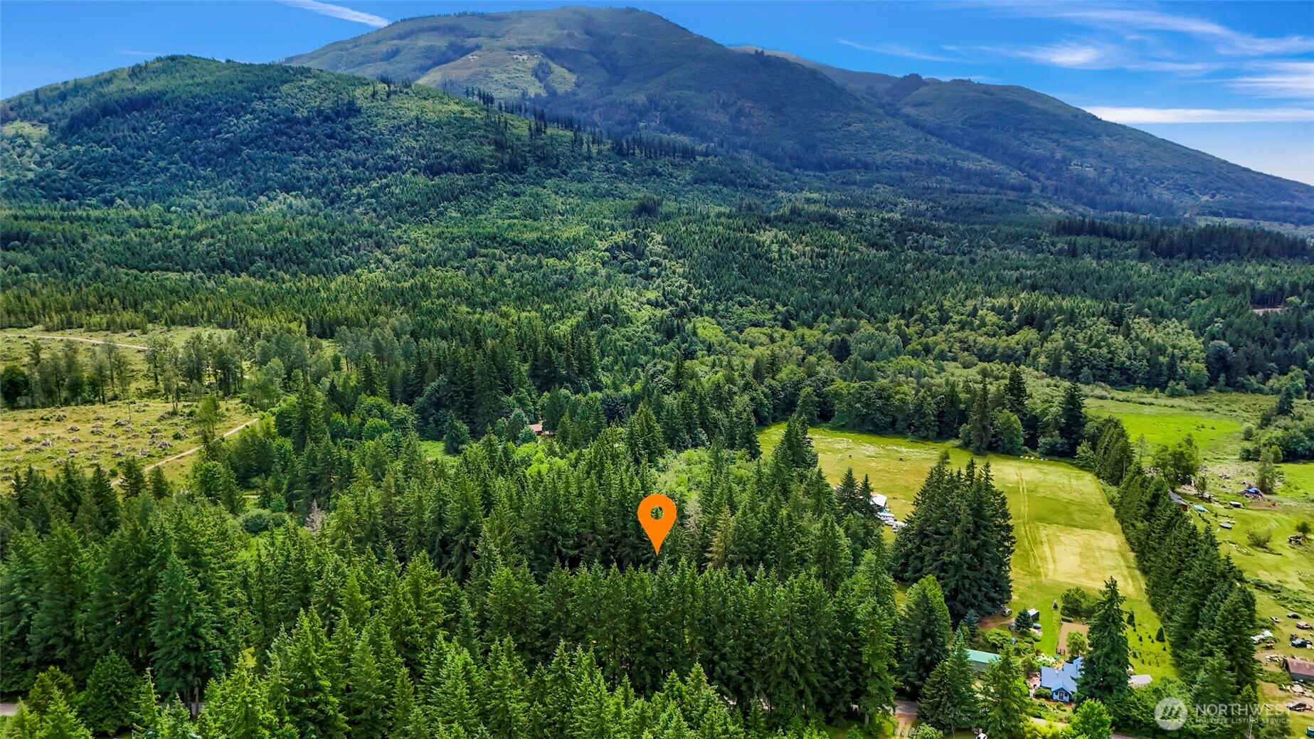 5650 Doran Road Acme, WA 98220 - Photo 32 of 40 a aerial view of a house with a garden and mountains