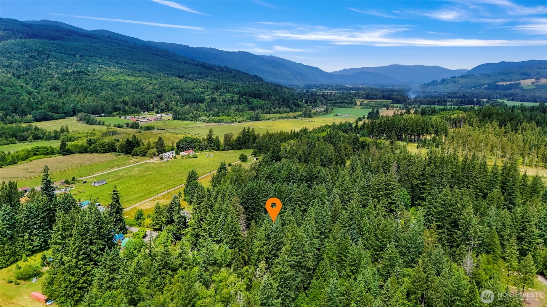 5650 Doran Road Acme, WA 98220 - Photo 37 of 40 a view of a lush green hillside and a houses