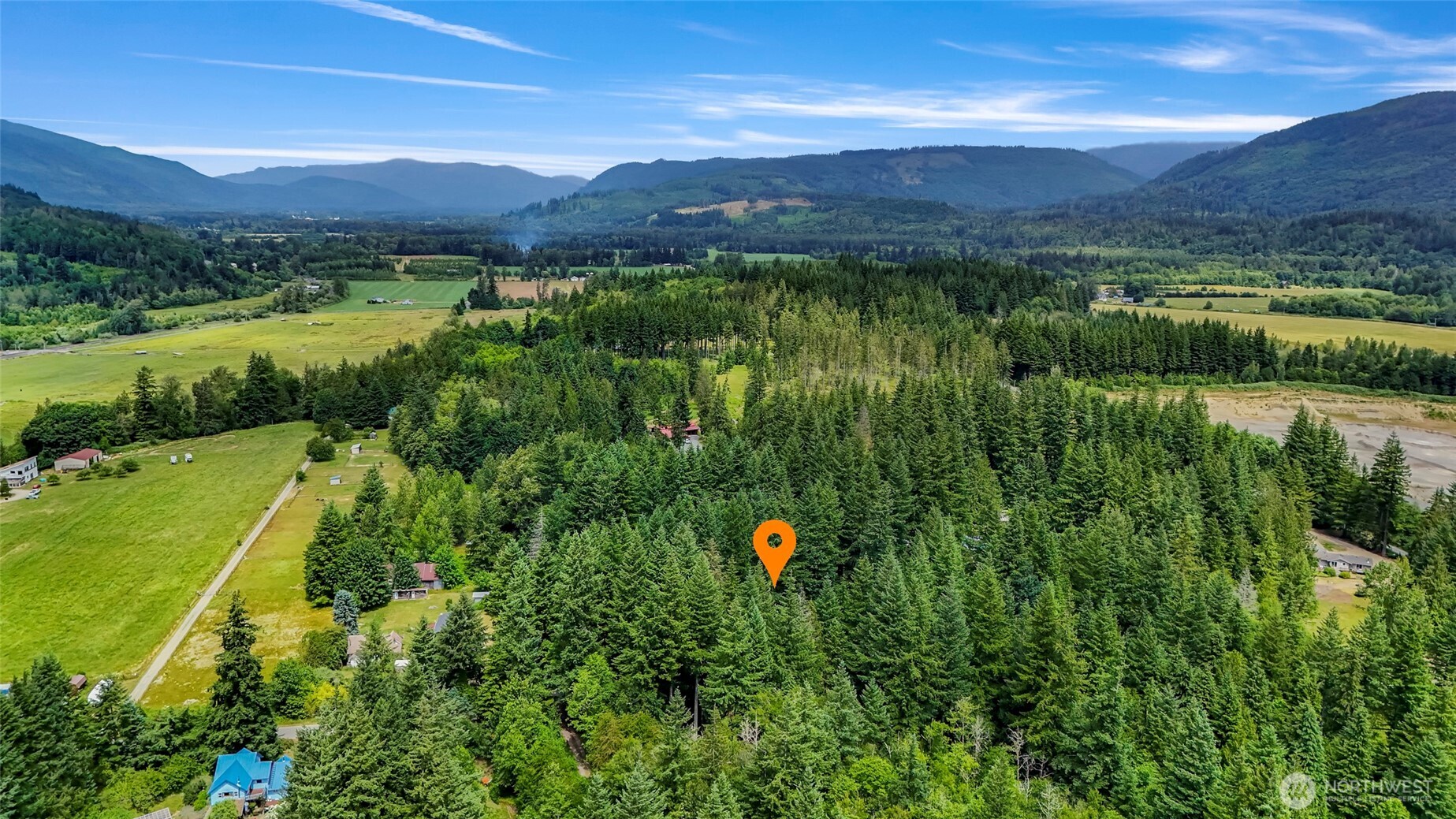 5650 Doran Road Acme, WA 98220 - Photo 38 of 40 a view of a lush green hillside and houses
