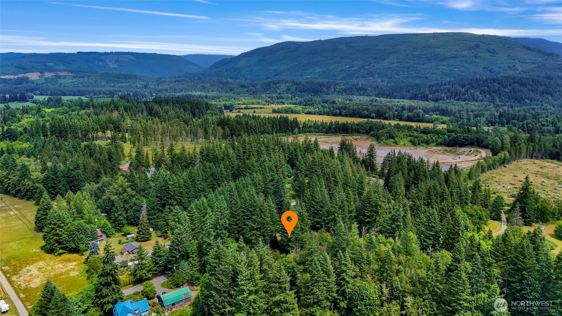 5650 Doran Road Acme, WA 98220 - Photo 39 of 40 a view of a lush green hillside and a houses