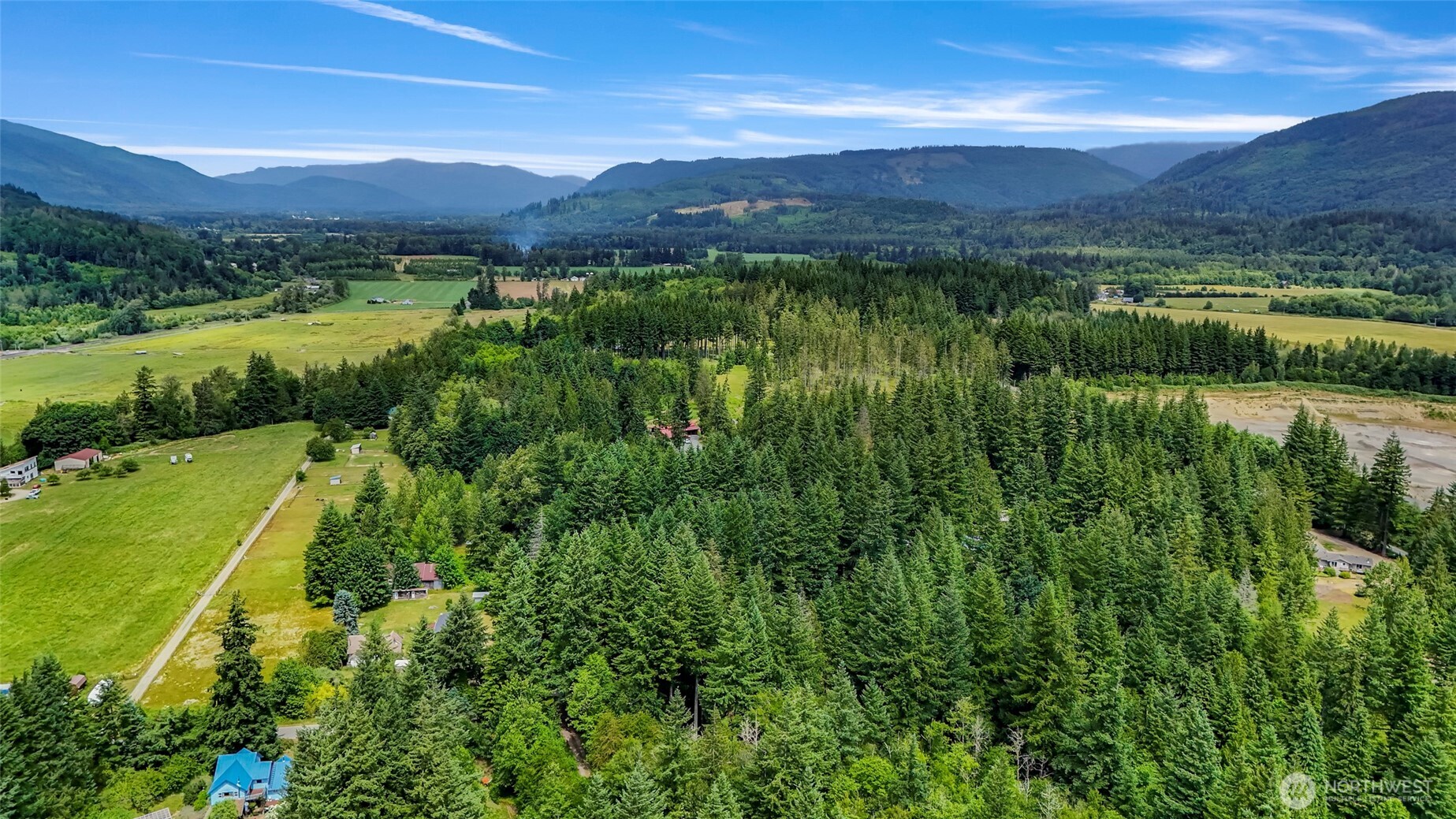 5650 Doran Road Acme, WA 98220 - Photo 10 of 40 a view of a lush green hillside and houses
