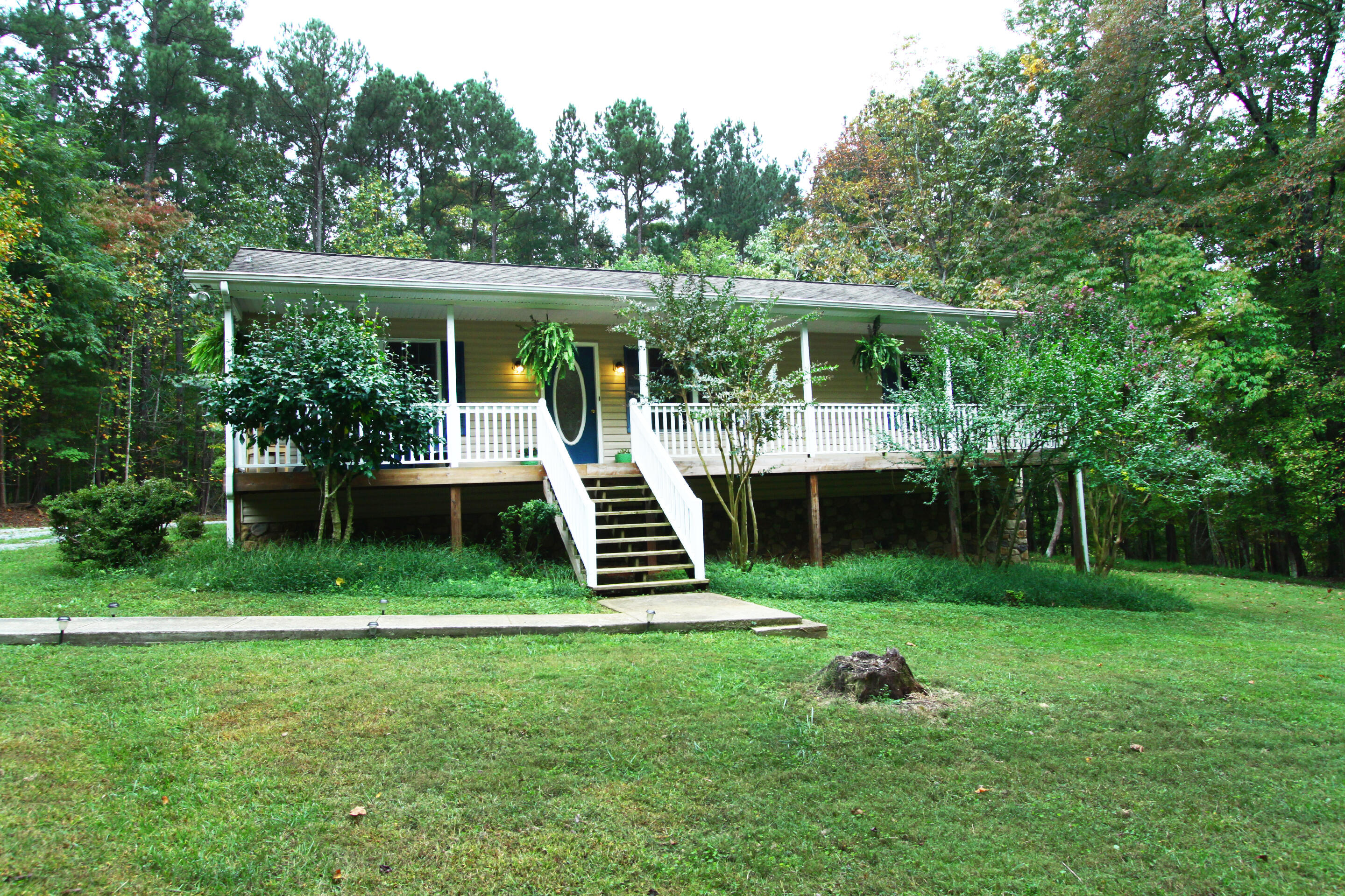 a front view of a house with a yard table and chairs