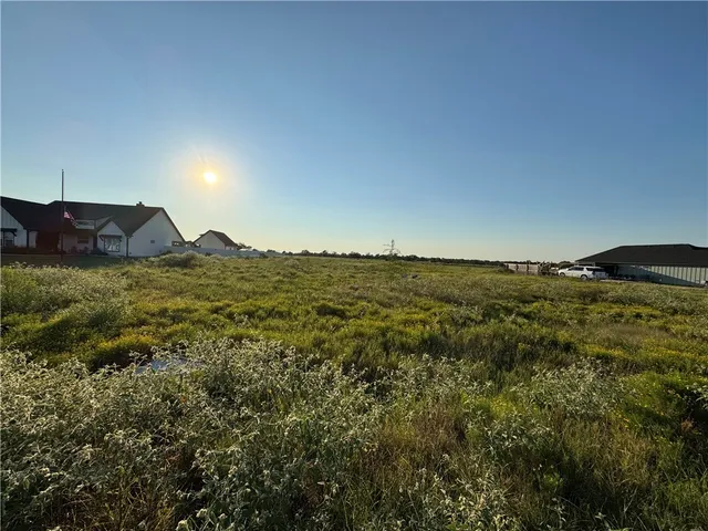 a view of a lake and a yard