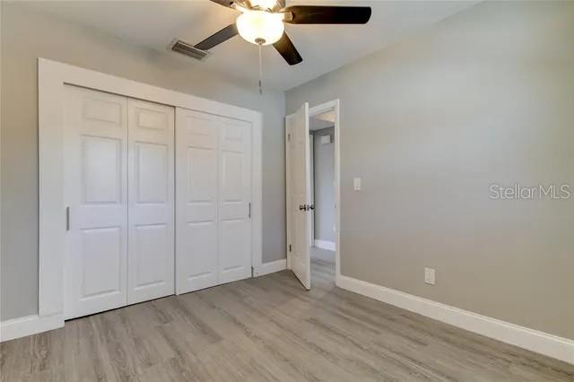 300 6th Street North, Unit W2 Safety Harbor, FL 34695 - Photo 16 of 22 a view of an empty room and wooden floor