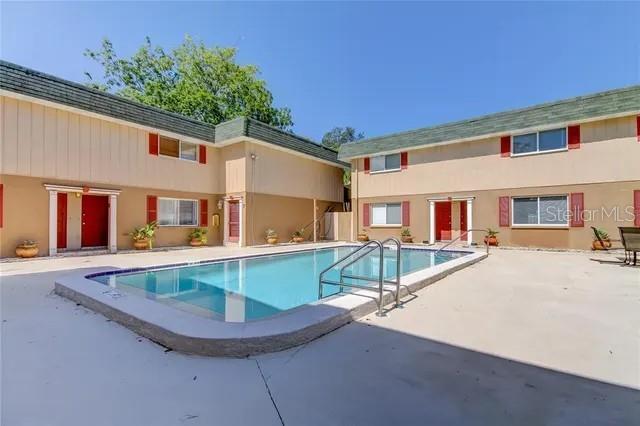 300 6th Street North, Unit W2 Safety Harbor, FL 34695 - Photo 2 of 22 front view of house with a patio