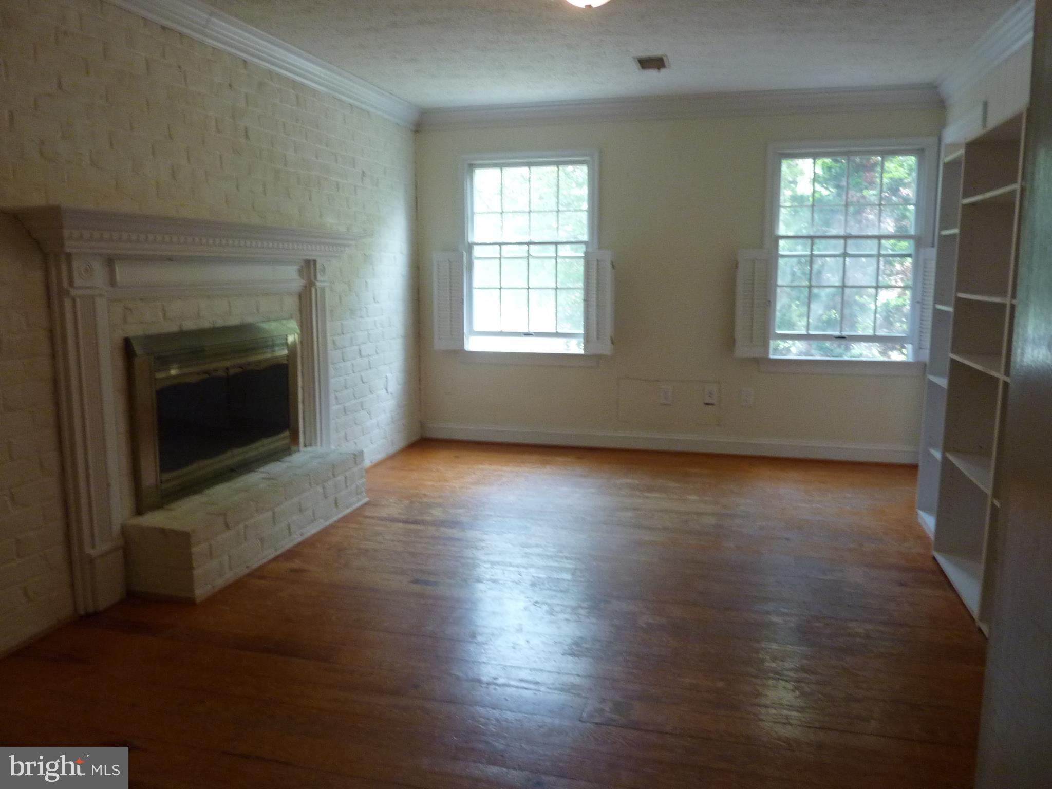 143 Stonebrook Road Winchester, VA 22602 - Photo 13 of 21 Study with Fireplace and bookshelves
