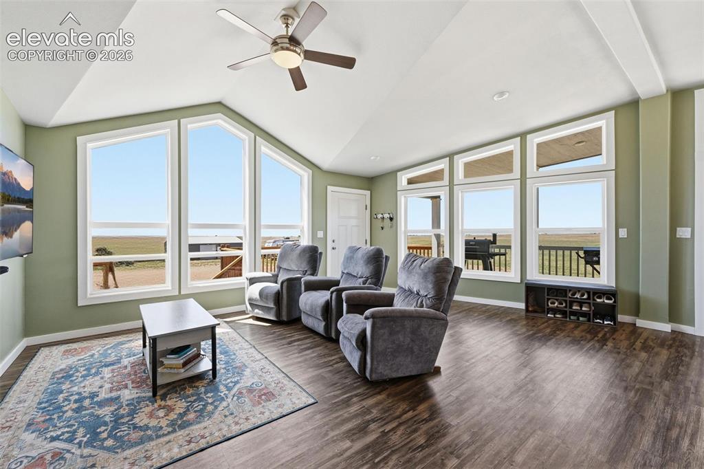 23335 Sanborn Road Calhan, CO 80808 - Photo 6 of 28 Vaulted great room filled with natural light and expansive windows