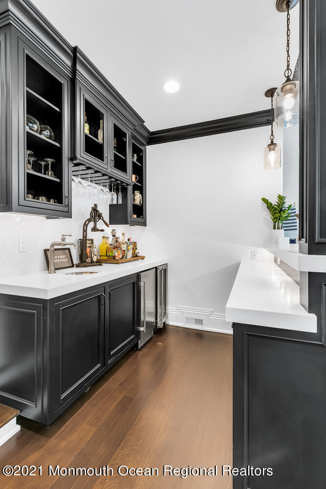 7 Sheraton Lane Rumson, NJ 07760 - Photo 12 of 32 a bathroom with a sink and a mirror