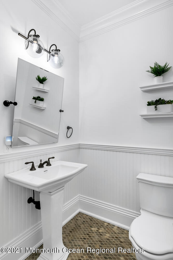 7 Sheraton Lane Rumson, NJ 07760 - Photo 14 of 32 a bathroom with a sink a toilet and mirror