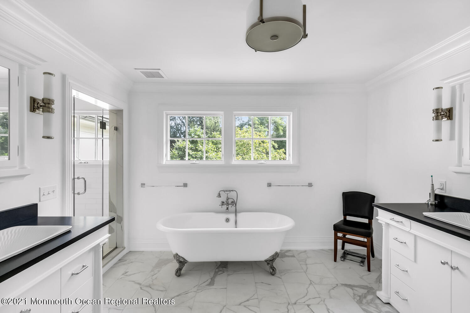 7 Sheraton Lane Rumson, NJ 07760 - Photo 16 of 32 a spacious bathroom with a tub sink and mirror