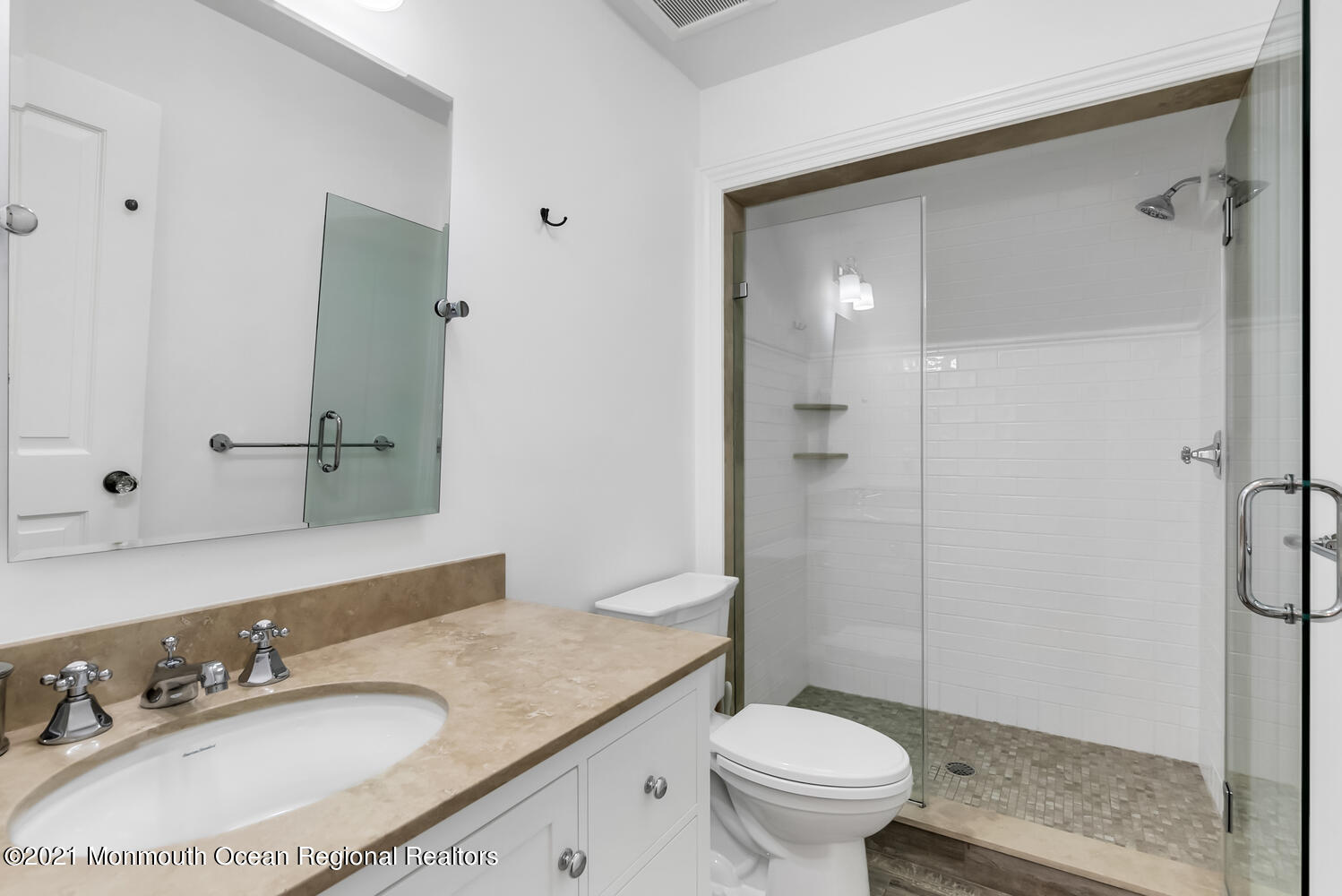 7 Sheraton Lane Rumson, NJ 07760 - Photo 24 of 32 a bathroom with a granite countertop sink toilet a mirror and shower