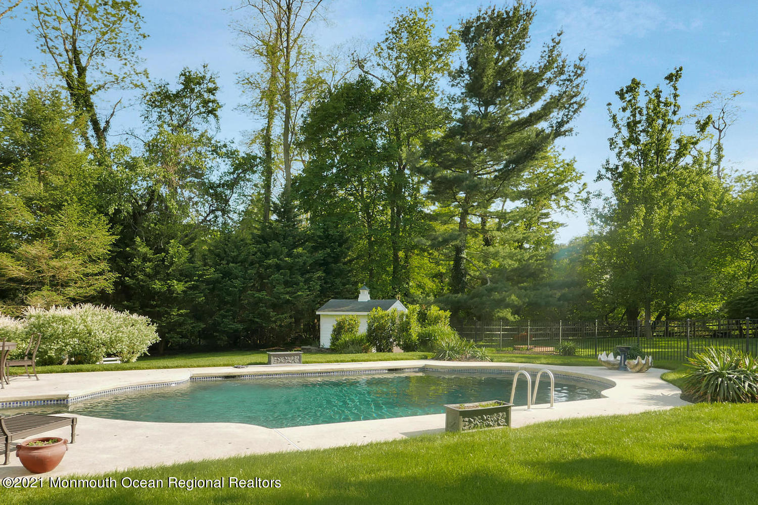 7 Sheraton Lane Rumson, NJ 07760 - Photo 27 of 32 a view of a yard with swimming pool
