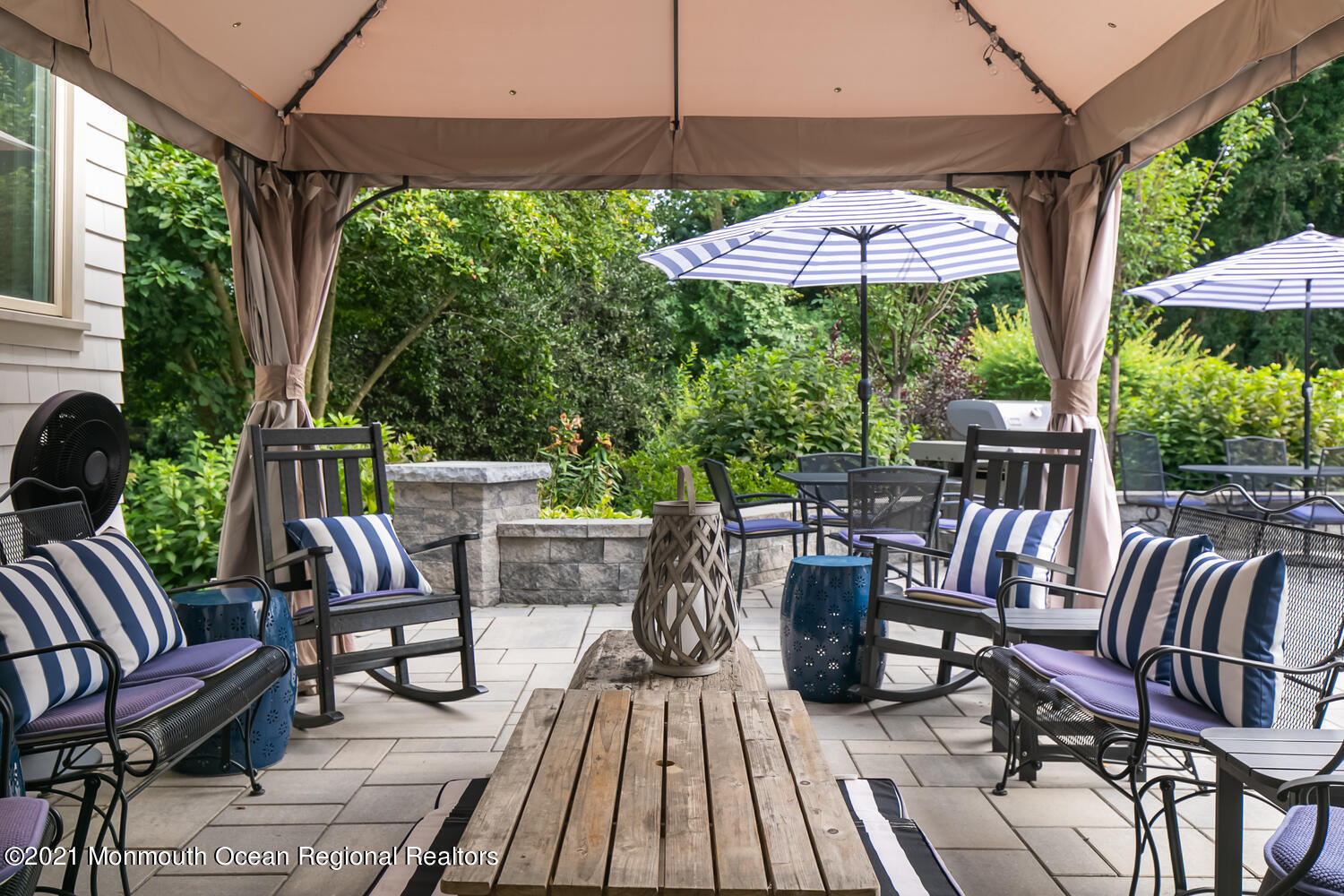 7 Sheraton Lane Rumson, NJ 07760 - Photo 29 of 32 a view of patio with table and chairs under an umbrella