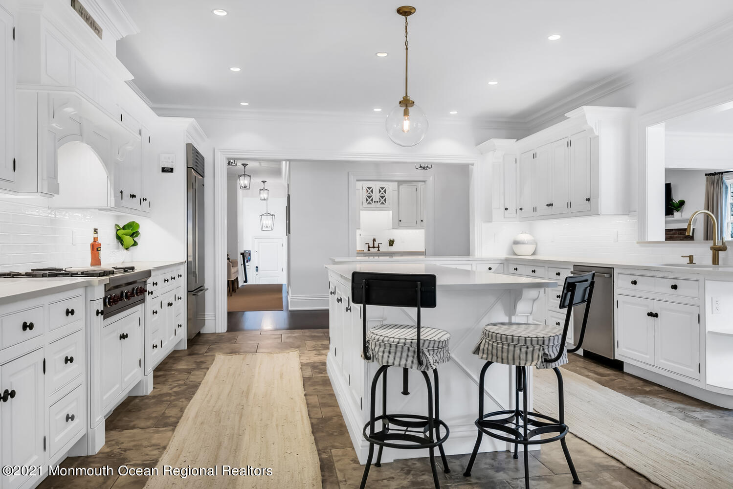 7 Sheraton Lane Rumson, NJ 07760 - Photo 6 of 32 a kitchen with stainless steel appliances kitchen island granite countertop a table chairs sink and cabinets