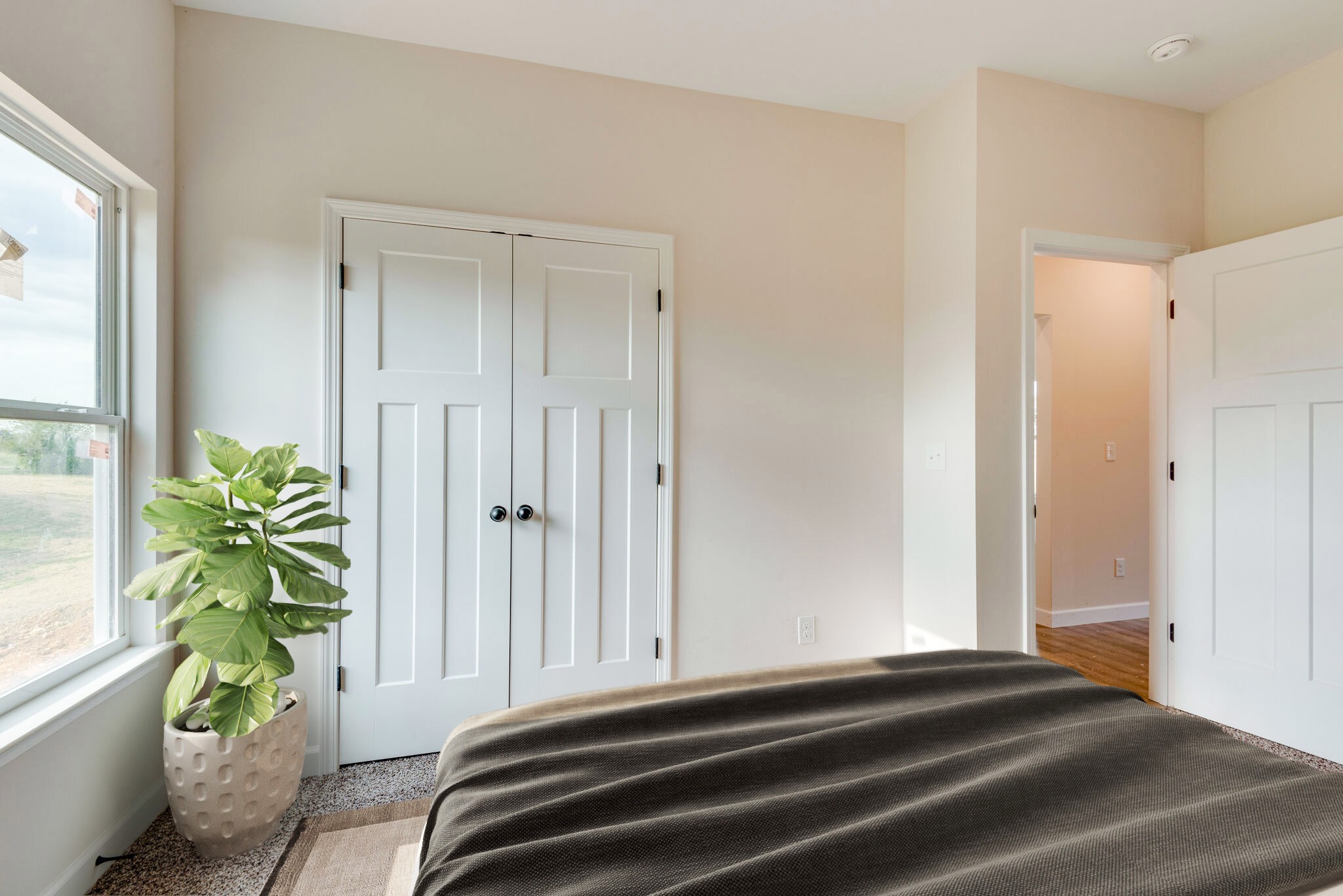 1282 Oak Grove Road Dickson, TN 37055 - Photo 23 of 29 a bedroom with a bed a potted plant and a window
