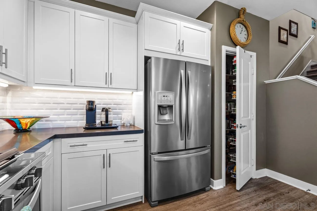 4326 Star Path Way, Unit 1 Oceanside, CA 92056 - Photo 20 of 46 a kitchen with appliances a refrigerator and a cabinets