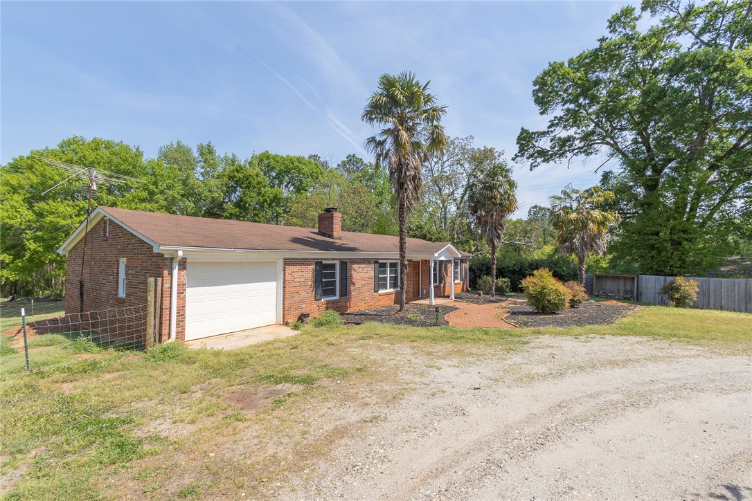 820 Travis Road Anderson, SC 29626 - Photo 7 of 46 This classic brick home offers both comfort and privacy.