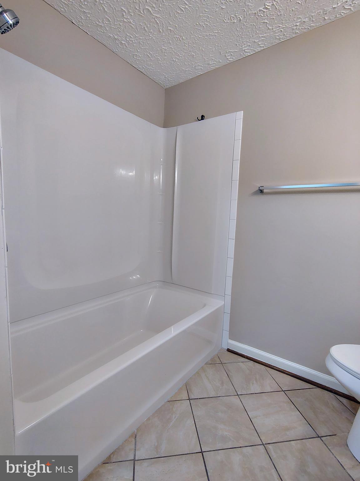 12407 Hickory Tree Way, Unit 524 Germantown, MD 20874 - Photo 10 of 21 a bathroom with a bathtub