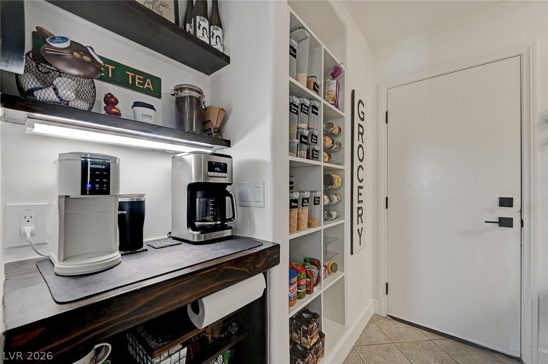 1072 Reed Point Court Henderson, NV 89002 - Photo 14 of 60 A well-organized pantry offers smart shelving and a dedicated coffee station.