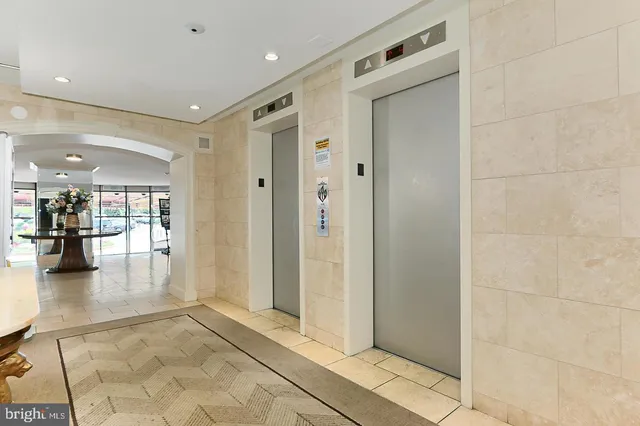 a view of swimming pool with outdoor seating and a patio