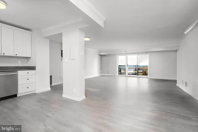a view of a kitchen with a sink cabinets and a window