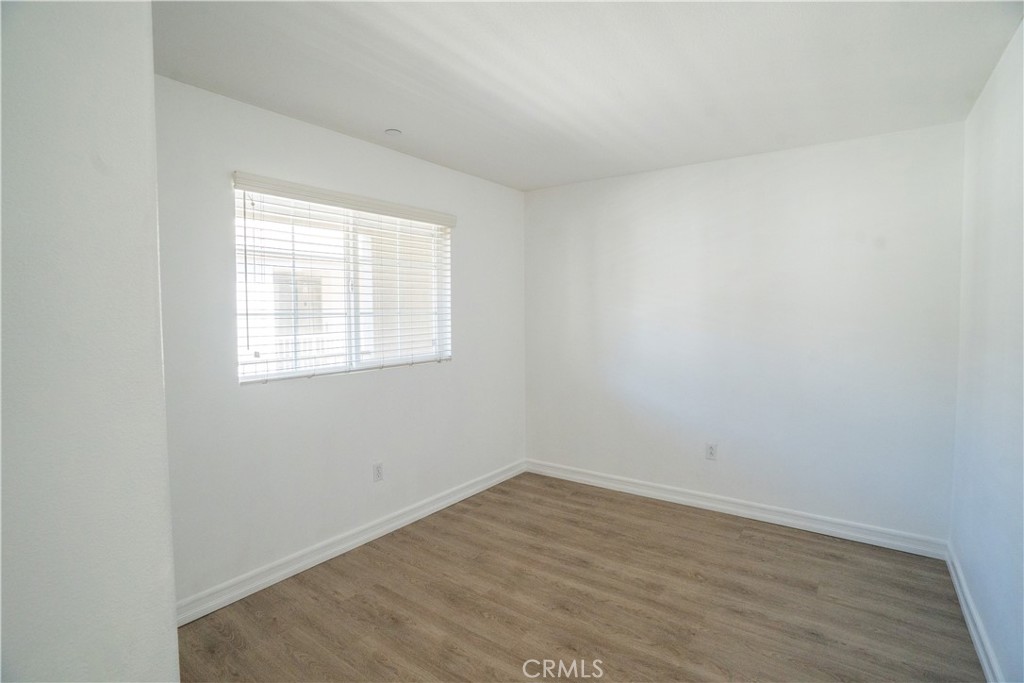 1401 Lomita Boulevard, Unit 302 Harbor City, CA 90710 - Photo 14 of 29 wooden floor in an empty room with a window