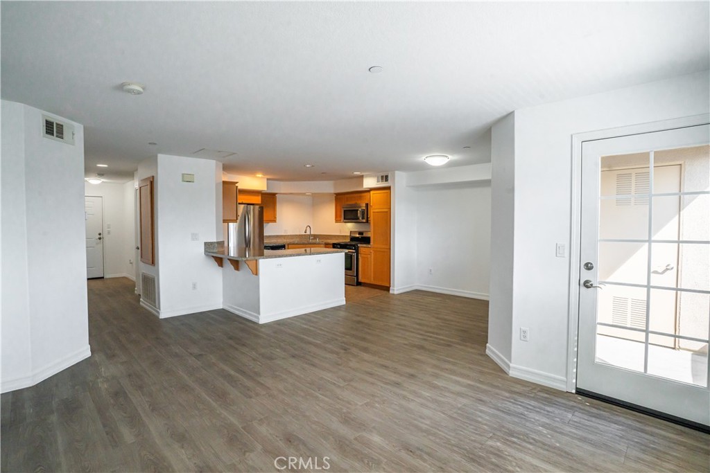 1401 Lomita Boulevard, Unit 302 Harbor City, CA 90710 - Photo 3 of 29 a view of kitchen view wooden floor and window