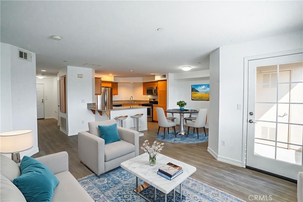 1401 Lomita Boulevard, Unit 302 Harbor City, CA 90710 - Photo 4 of 29 a living room with furniture and a table
