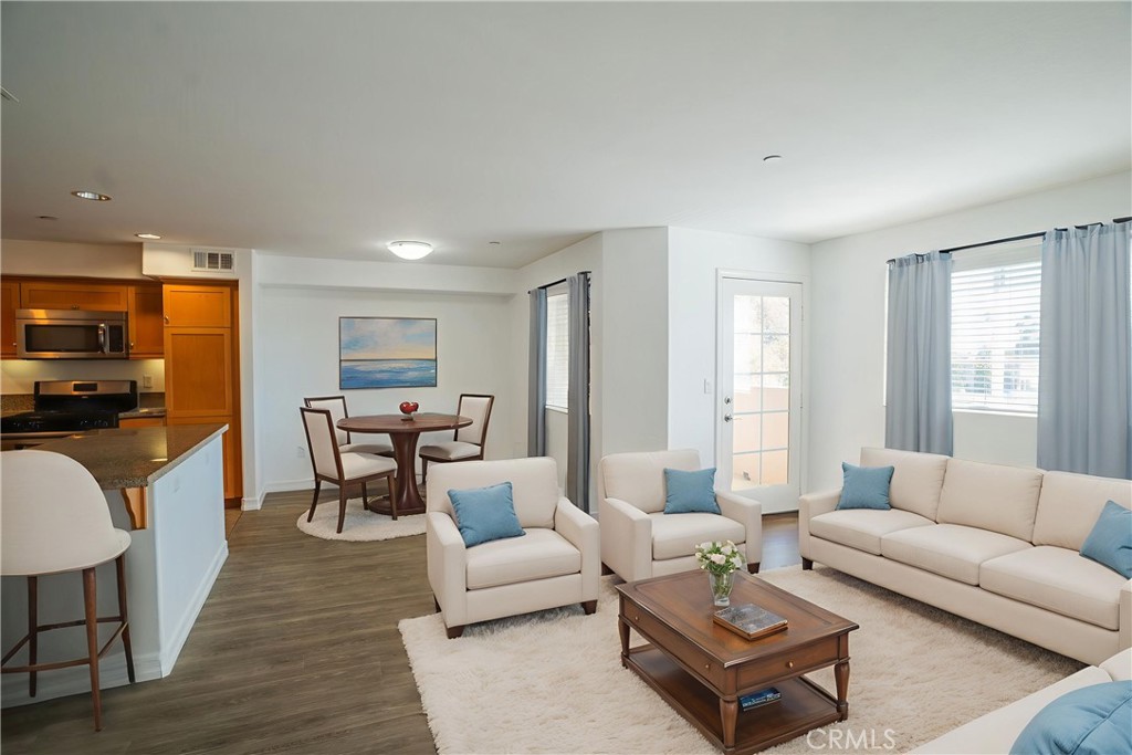 1401 Lomita Boulevard, Unit 302 Harbor City, CA 90710 - Photo 6 of 29 a living room with furniture kitchen view and a window