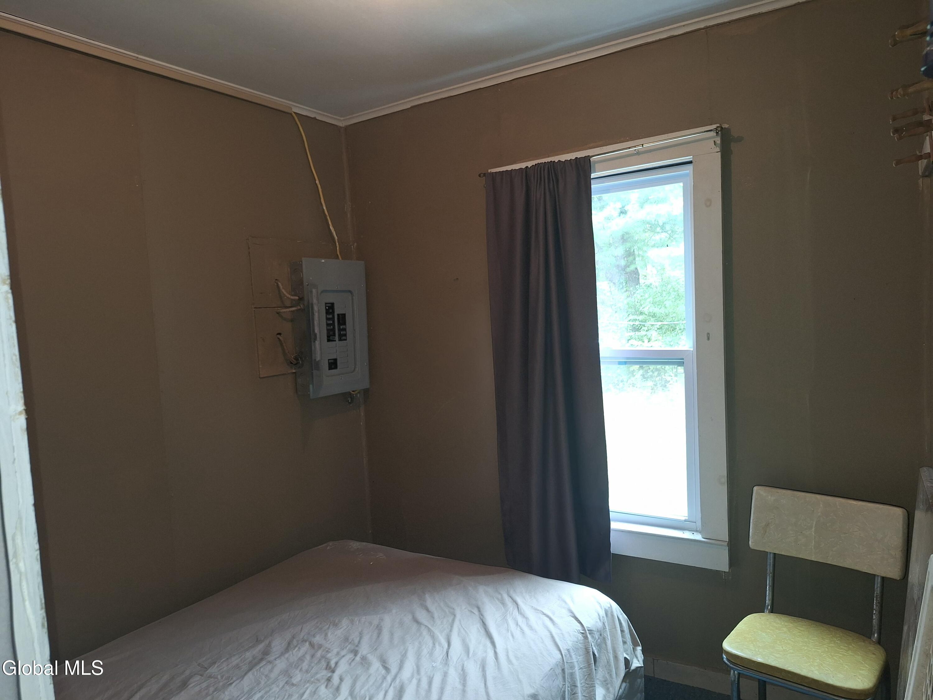 52 Wilson Bay Road Ticonderoga, NY 12883 - Photo 19 of 28 1 small bedroom queen bed bed.