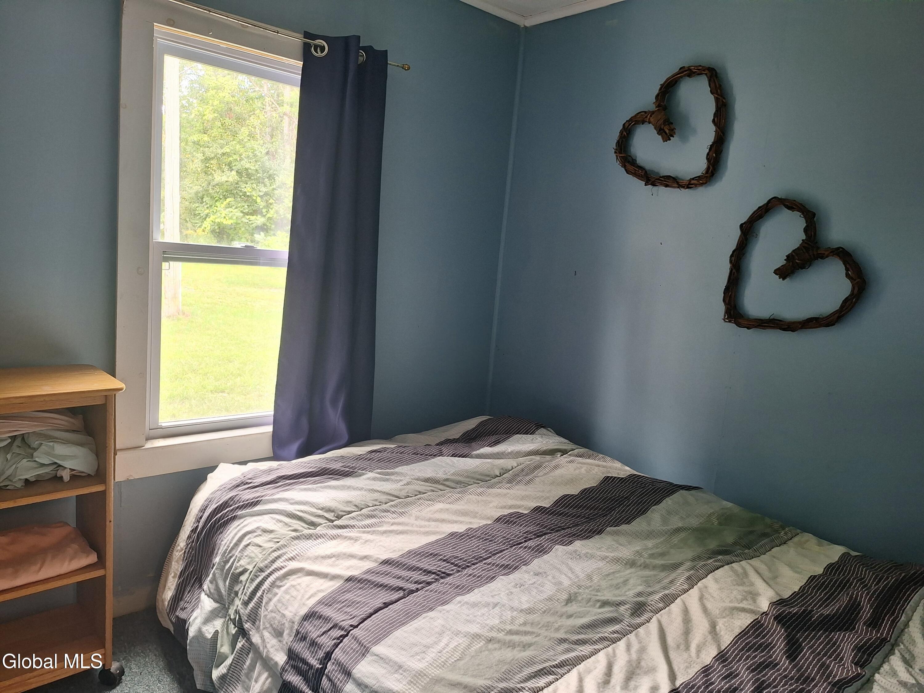 52 Wilson Bay Road Ticonderoga, NY 12883 - Photo 20 of 28 2nd small bedroom queen size bed.