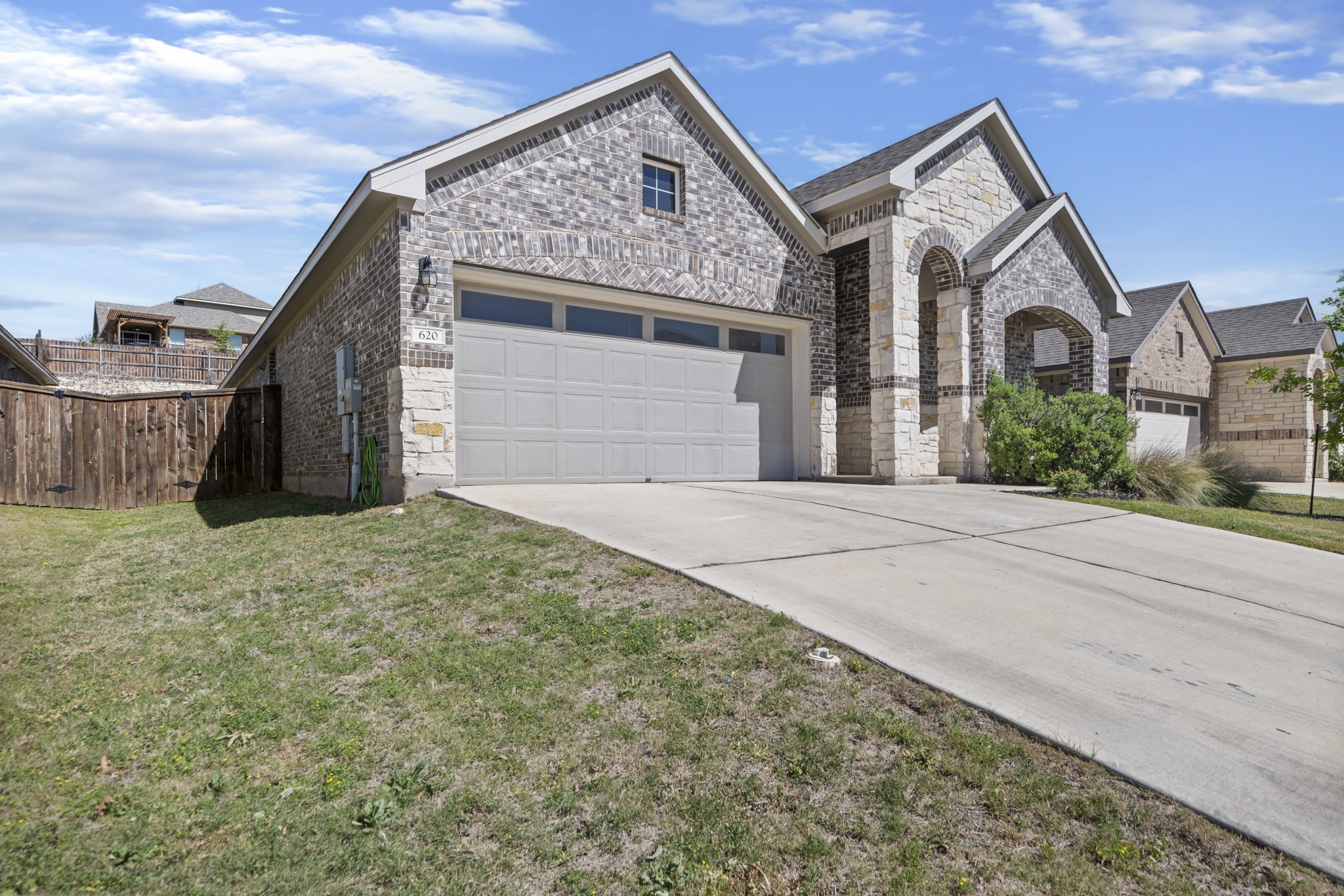 620 Peace Pipe Way Georgetown, TX 78628 - Photo 1 of 32 a front view of a house with a yard and garage