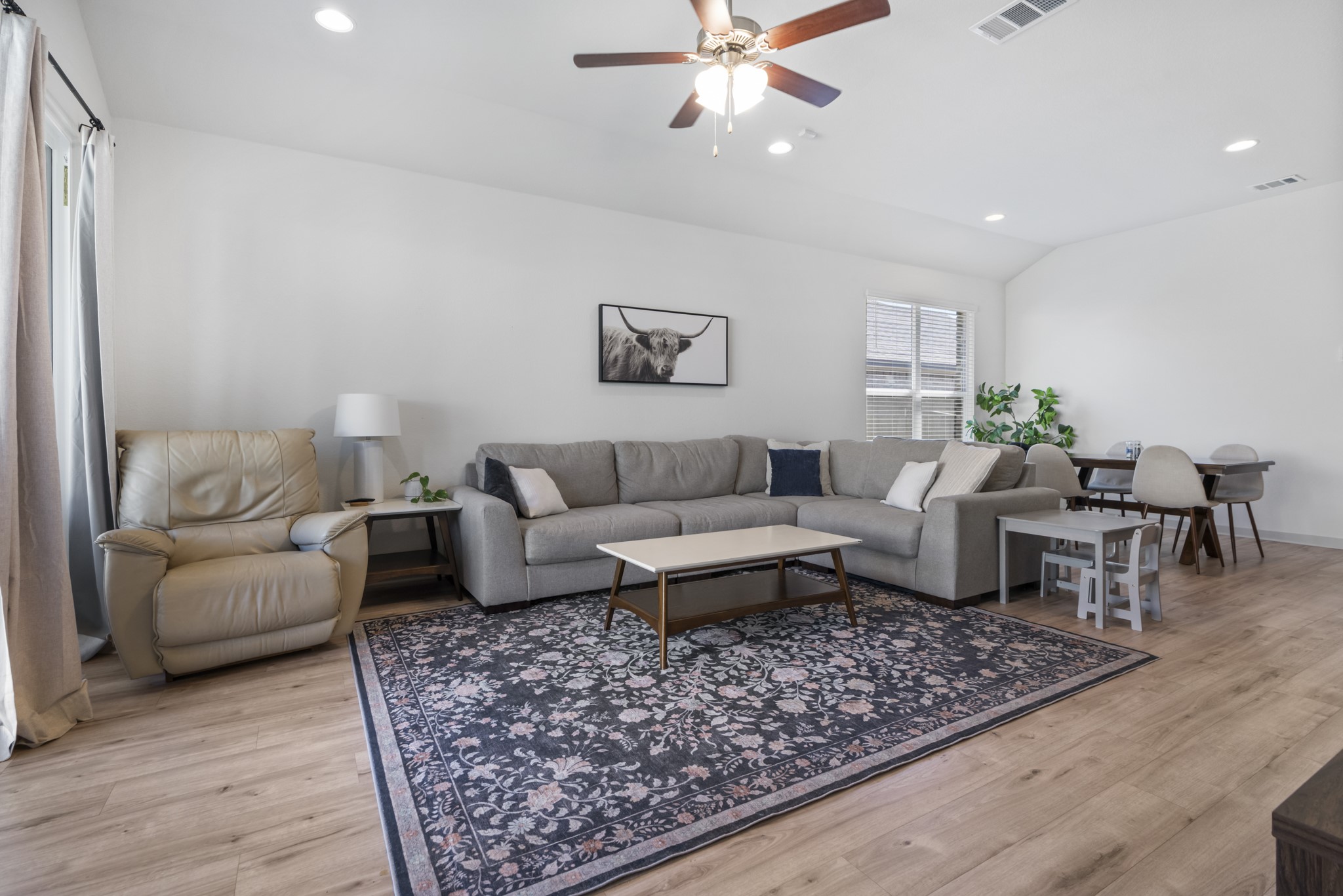 620 Peace Pipe Way Georgetown, TX 78628 - Photo 11 of 32 a living room with furniture and wooden floor