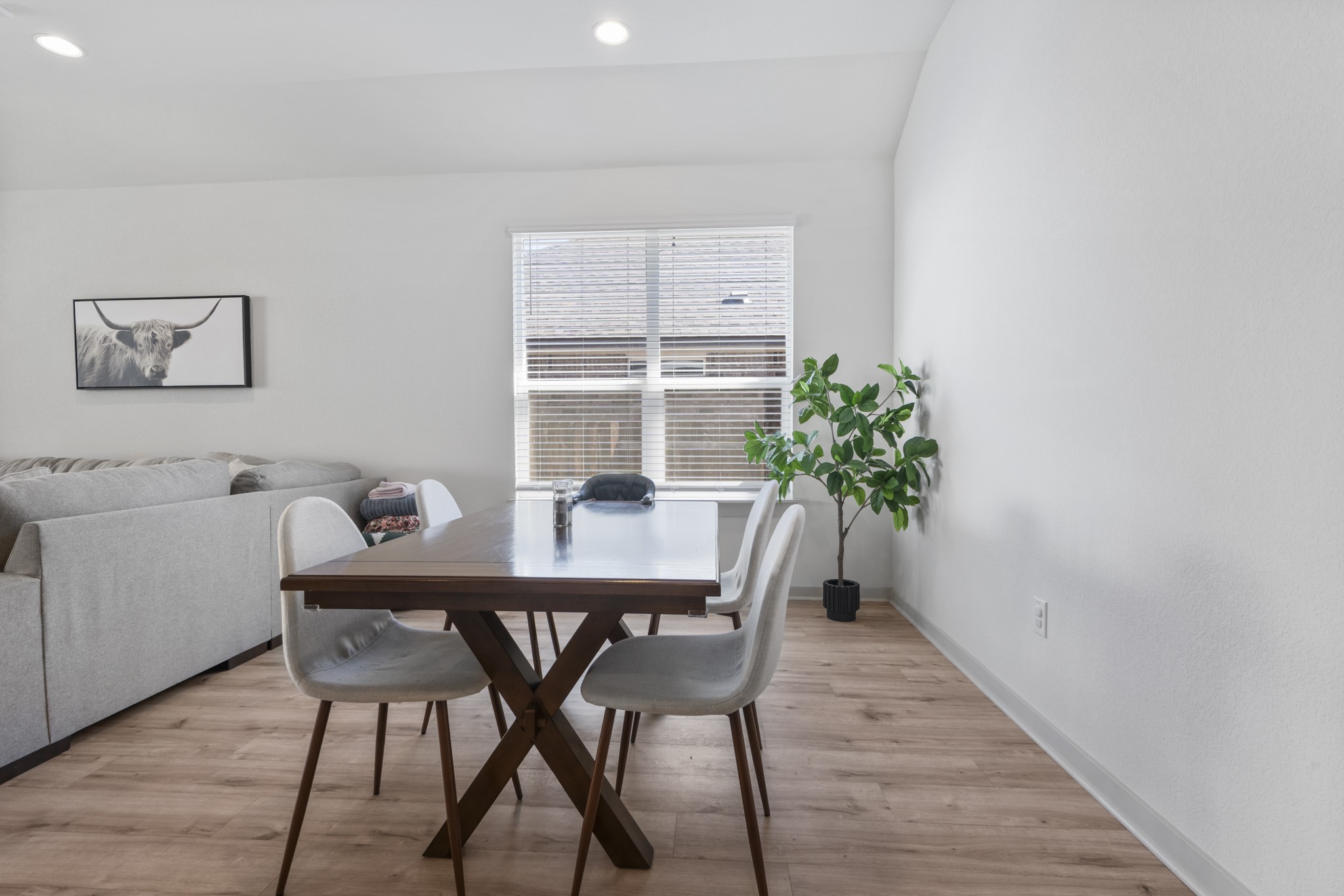 620 Peace Pipe Way Georgetown, TX 78628 - Photo 19 of 32 a view of a dining room with furniture and wooden floor