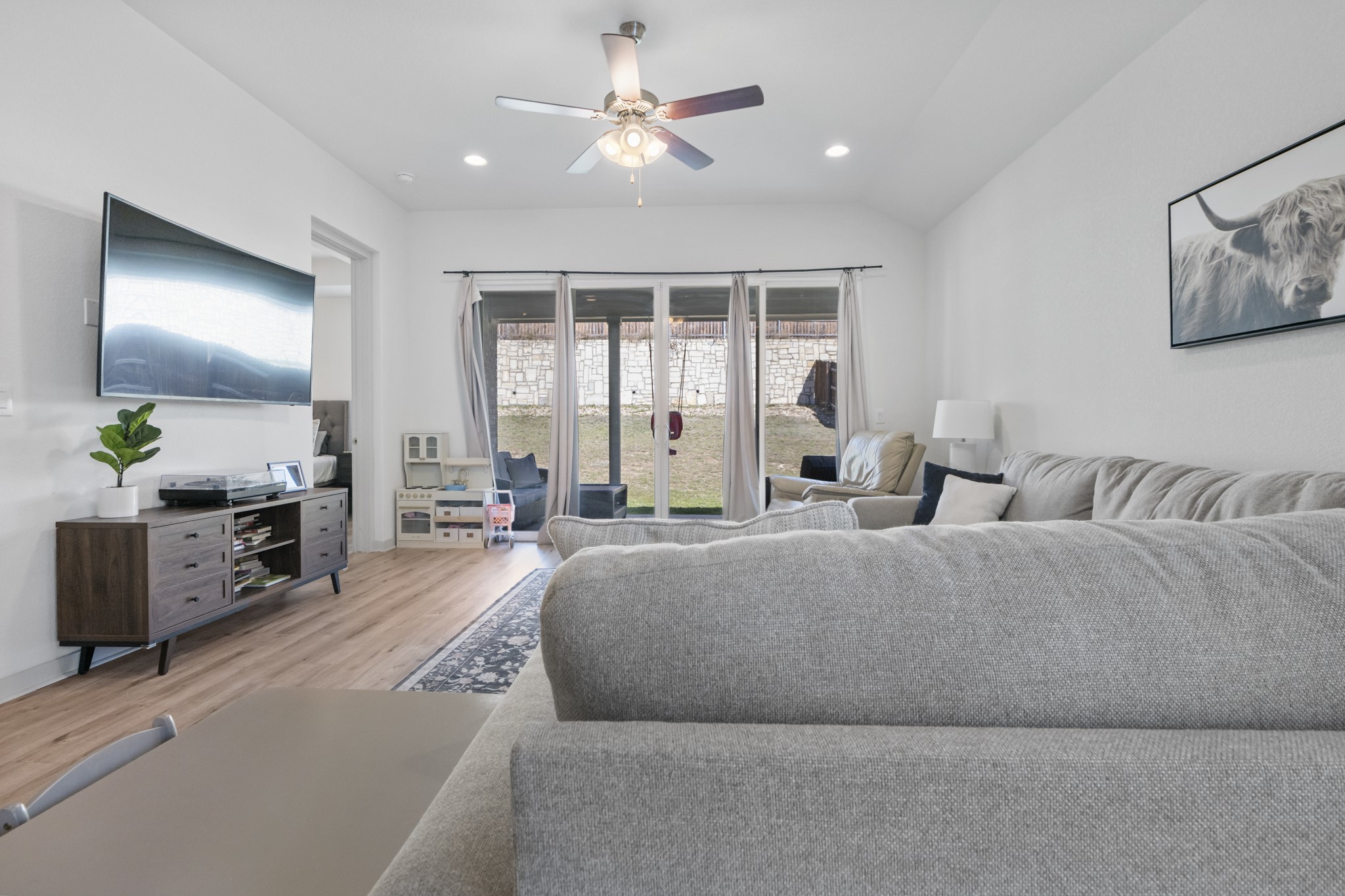 620 Peace Pipe Way Georgetown, TX 78628 - Photo 20 of 32 a living room with furniture and a chandelier
