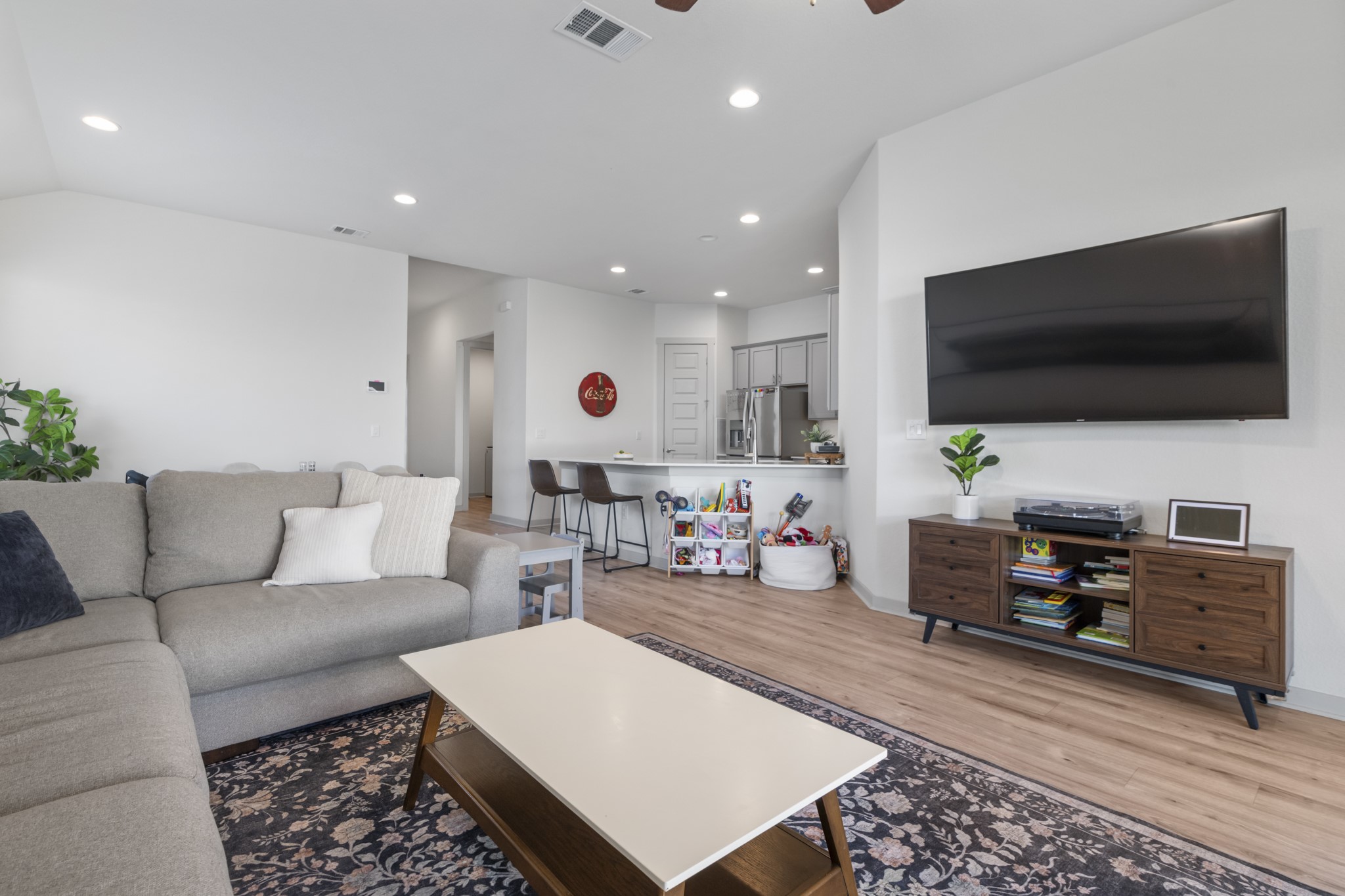 620 Peace Pipe Way Georgetown, TX 78628 - Photo 21 of 32 a living room with furniture and a flat screen tv