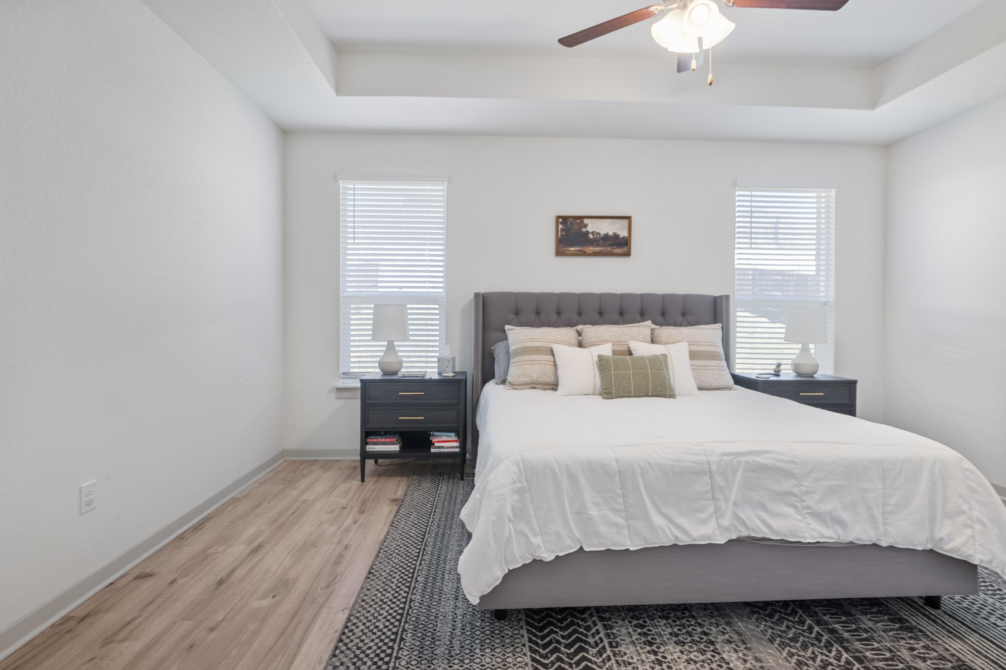 620 Peace Pipe Way Georgetown, TX 78628 - Photo 25 of 32 a bedroom with a bed and a chandelier