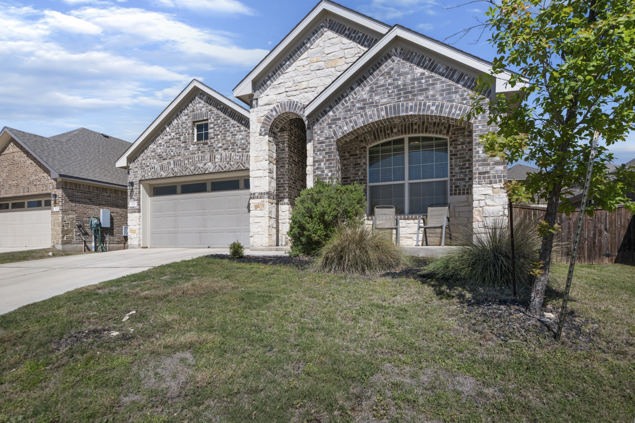 620 Peace Pipe Way Georgetown, TX 78628 - Photo 3 of 32 a front view of a house with garden