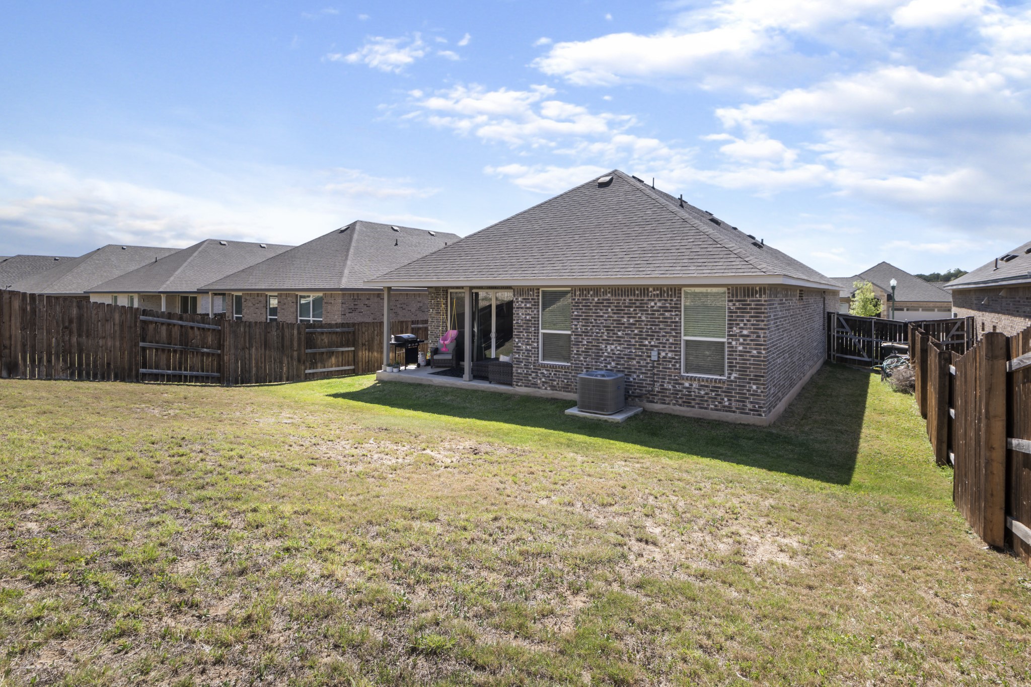620 Peace Pipe Way Georgetown, TX 78628 - Photo 29 of 32 a view of a house with a backyard